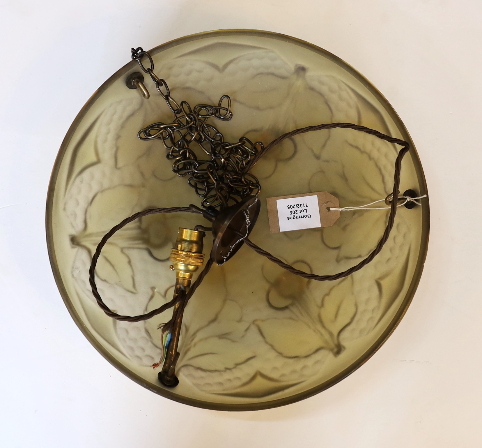 A 1920s-30s French moulded glass light bowl decorated with stylised fruit, with chain set and ceiling rose, diameter 35cm